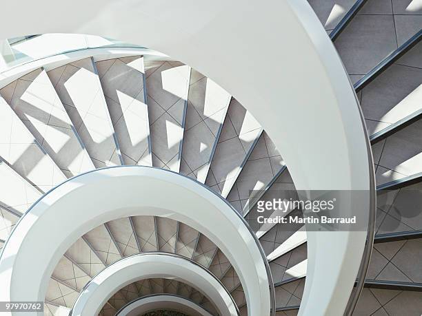 directly above modern, spiral staircase - architecture stockfoto's en -beelden