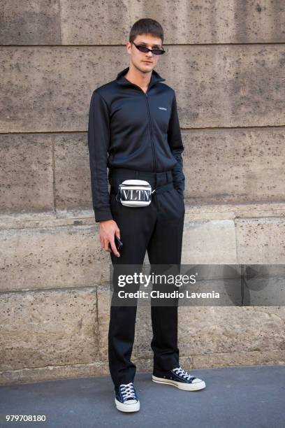 Guido Milani, wearing black jacket, black pants and Valentino belt bag, is seen in the streets of Paris after the Valentino show, during Paris Men's...
