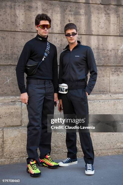 Marc Forne, wearing black pullover, black pants and Valentino belt bag and Guido Milani, wearing black jacket, black pants and Valentino belt bag,...