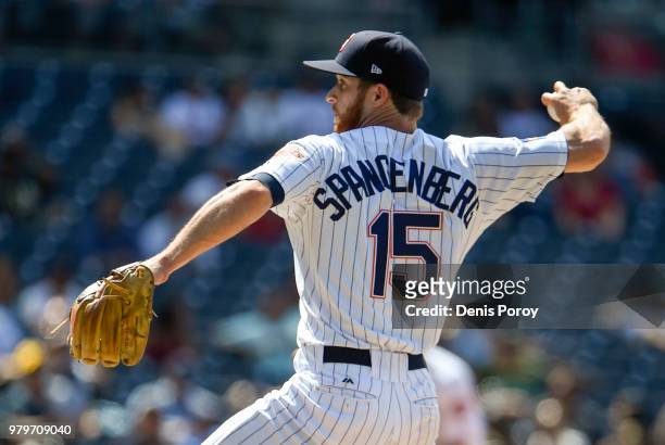 Cory Spangenberg of the San Diego Padres pitches during the ninth inning of a baseball game against the Oakland Athletics at PETCO Park on June 20,...