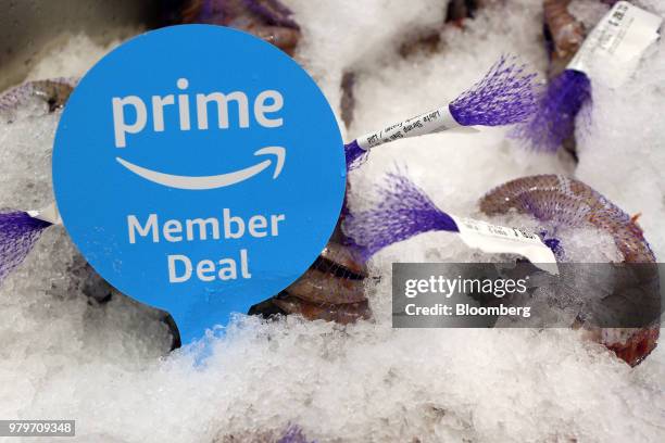 Sign alerts Amazon.com Inc. Prime members of a special deal on shrimp during the grand opening of a Whole Foods Market Inc. Location in Burbank,...