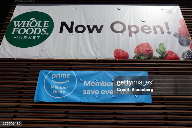 Sign alerts Amazon.com Inc. Prime members of special savings during the grand opening of a Whole Foods Market Inc. Location in Burbank, California,...