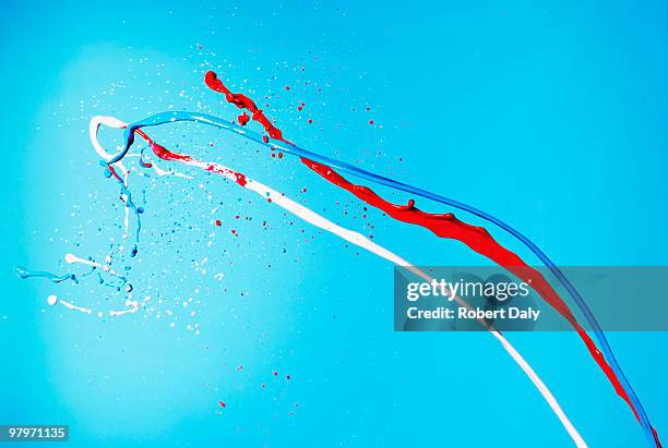 red, white and blue paint splashing - red blue background stockfoto's en -beelden