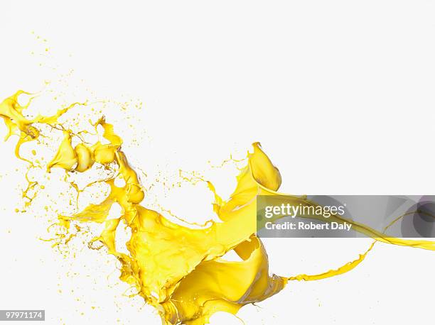 spruzzi di vernice gialla - paints foto e immagini stock