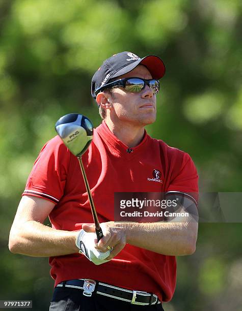 Nick O'Hern of Australia and the Isleworth Team watches his tee shot on the 3rd hole during the second day's play in the 2010 Tavistock Cup, at the...
