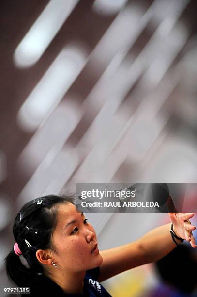 Brazilian Karin Sako eyes the ball as she plays during a training session at the IX South American Games in Medellin, Antioquia department, Colombia...