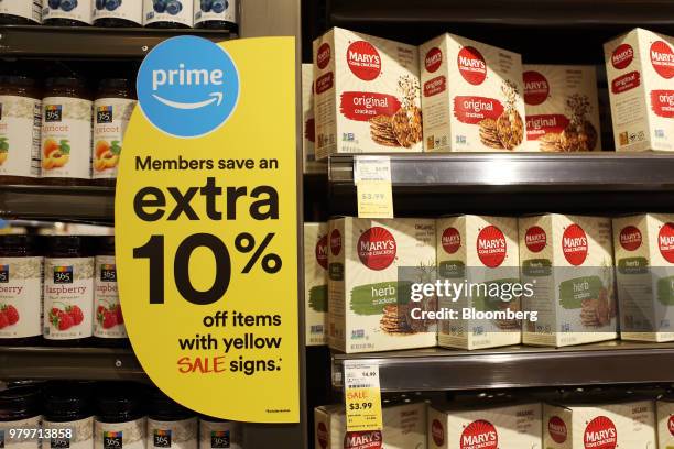 Sign alerts Amazon.com Inc. Prime members of savings during the grand opening of a Whole Foods Market Inc. Location in Burbank, California, U.S., on...