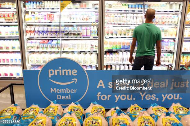 Sign alerts Amazon.com Inc. Prime members of a special deal on organic chickens during the grand opening of a Whole Foods Market Inc. Location in...