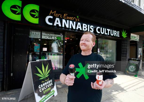 Authorized marijuana distributor John Berfelo stands outside Marc Emery's Cannabis Cafe as he holds two accredited child resistant packaging...
