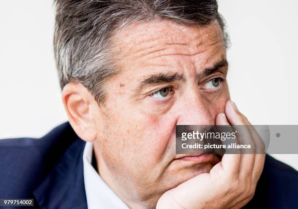 August 2017, Germany, Berlin: German Foreign Minister Außenminister Sigmar Gabriel of the Social Democratic Party , rests his chin on the palm of his...