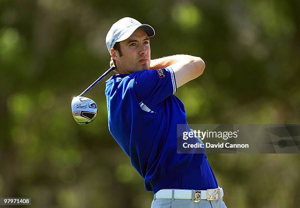 Ross Fisher of England and the Lake Nona Team watches his tee shot on the 3rd hole during the second day's play in the 2010 Tavistock Cup, at the...