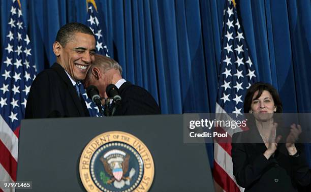 President Barack Obama and Vice President Joe Biden embrace before the president speaks at a rally celebrating the final passage of the Patient...