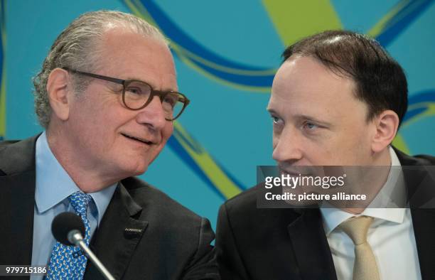 March 2018, Germany, Darmstadt: Chief executive Stefan Oschmann and chief financial officer Marcus Kuhnert talking. The Merck boss will speak of the...