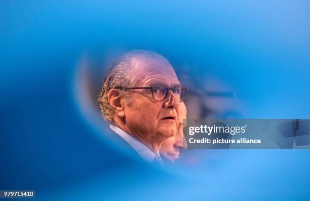 March 2018, Germany, Darmstadt: Chief executive Stefan Oschmann taking his place on the podium behing a blue plastic sculpture. The Merck boss will...