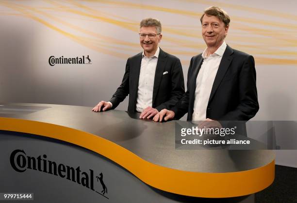 March 2018, Germany, Hannover: Chief executive Elmar Degenhart and chief financial officer Wolfgang Schaefer before the start of the press conference...