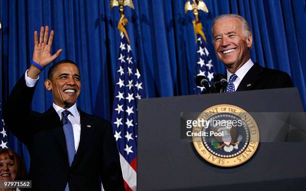 President Barack Obama and Vice President Joe Biden smile and wave at a rally celebrating the final passage of the Patient Protection and Affordable...