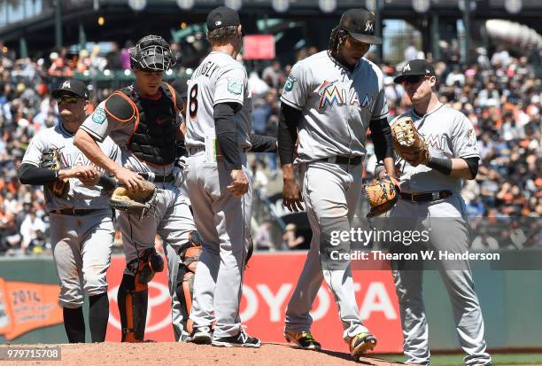 Manager Don Mattingly of the Miami Marlins takes the ball from starting pitcher Jose Urena taking Urena out of the game against the San Francisco...