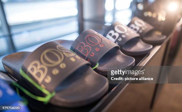 March 2018, Germany, Metzingen: Flip-flops from the brand Hugo Boss presented during a annual balance sheet press conference for the year 2017....