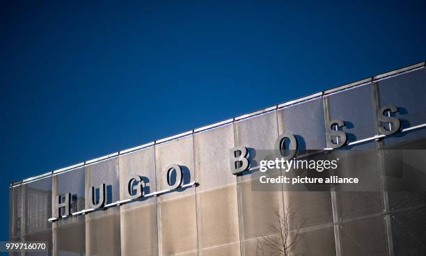 March 2018, Germany, Metzingen: The Hugo Boss sign on the car park on the day of the annual balance sheet press conference for the year 2017. Photo:...