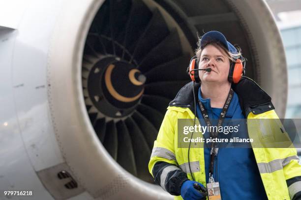 March 2018, Germany, Frankfurt: Sabrina Boock, responsible for aircraft handling, checking the airoworthiness of the Lufthansa Airbus A 321 before...