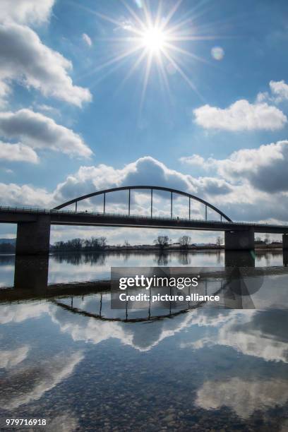 March 2018, Germany, Deggendorf: The sun shines bright above the bridge of the A92 motorway spanning across the Danube. Photo: Armin Weigel/dpa