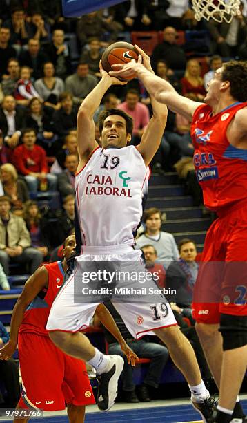 Fernando San Emeterio, #19 of Caja Laboral competes with Sasha Kaun, #24 of CSKA Moscow in action during the Euroleague Basketball 2009-2010 Play Off...