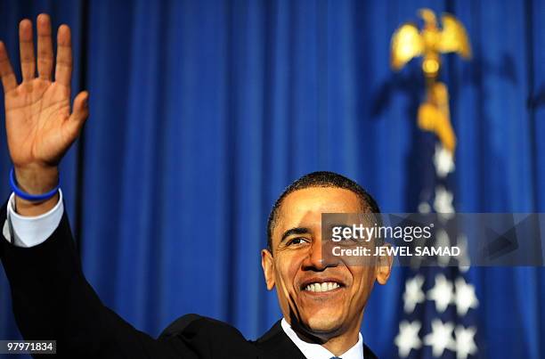 President Barack Obama waves at the audience members during a rally celebrating the passage and signing into law of the Patient Protection and...