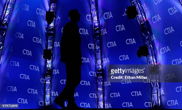 Chairman of Telefonica Internacional, USA Inc. Inaki Urdangarin is silhouetted as he watches a video during his keynote address at the International...