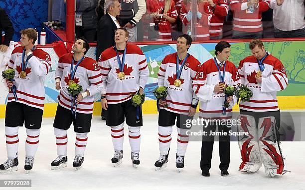 Eric Staal, Dan Boyle, Corey Perry, Scott Niedermayer, March-Andre Fleury and Martin Broadeur of Canada line up together prior to the playing of the...