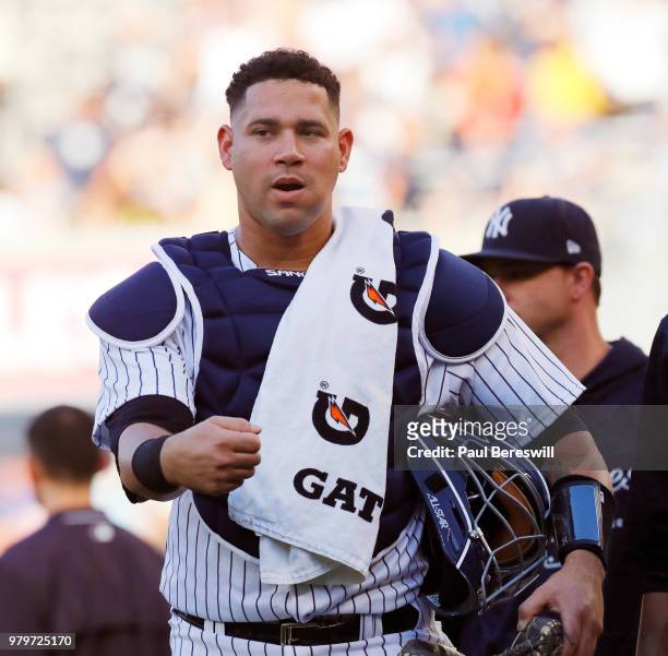 Catcher Gary Sanchez of the New York Yankees walks in from the bullpen to start an MLB baseball game against the Tampa Bay Rays on June 14, 2018 at...
