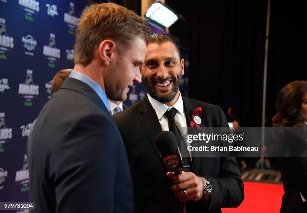 Aleksander Barkov and Roberto Luongo of the Florida Panthers arrive at the 2018 NHL Awards presented by Hulu at the Hard Rock Hotel & Casino on June...