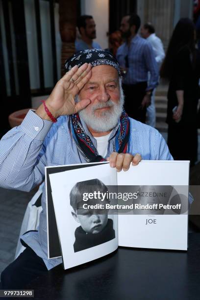 Photographer Bruce Weber signs the book "Azzedine, Bruce and Joe" at Galerie Azzedine Alaia on June 20, 2018 in Paris, France