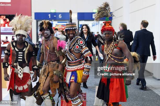 March 2018, Germany, Berlin: A dance group from Zambia dancing through a hallway of the International Tourism Fair . Photo: Maurizio Gambarini/dpa