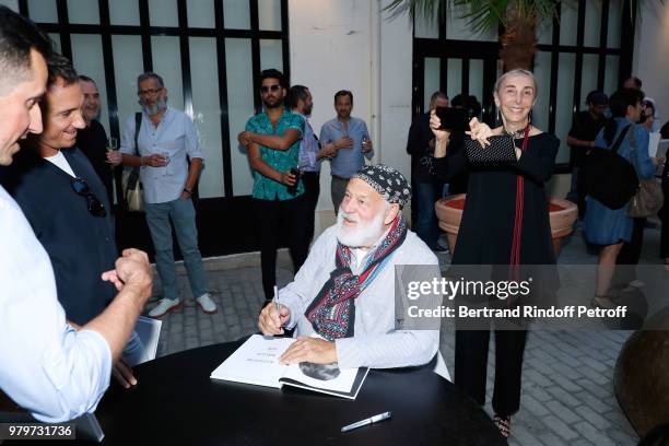 Bruce Weber and Carla Sozzani attend photographer Bruce Weber signs the book "Azzedine, Bruce and Joe" at Galerie Azzedine Alaia on June 20, 2018 in...