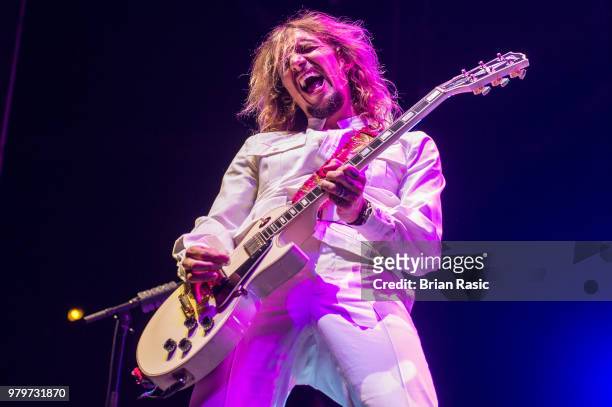 Justin Hawkins of The Darkness performs live on stage at Wembley Arena on June 20, 2018 in London, England.