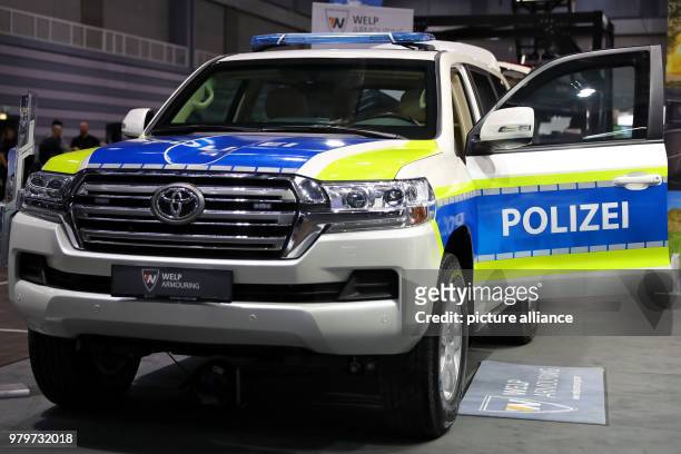 March 2018, Germany, Nuremberg: An armoured vehicle of the police is exhibited at the stand of the German company WELP Armouring at the "Enforce Tac"...
