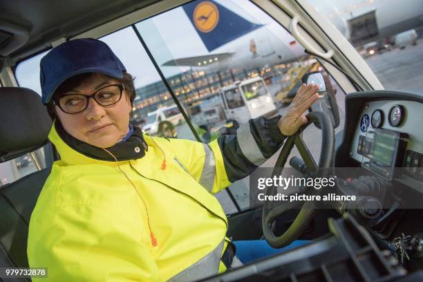Luggage driver Danuta Keller drives a luggage delivery vehicle for the Lufthansa Airbus A 321 before its flight to Berlin, in Frankfurt, Germany, 08...