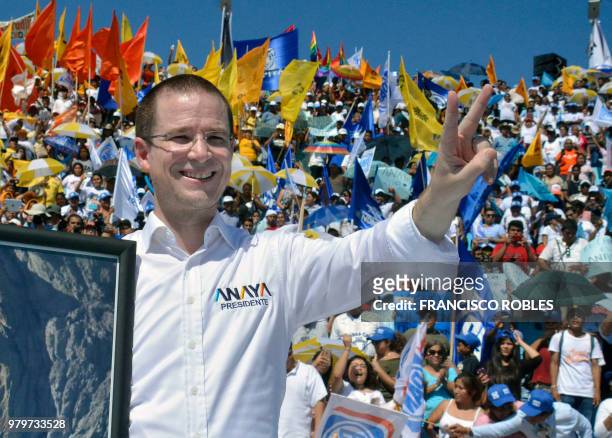 Mexico's presidential candidate Ricardo Anaya, standing for the "Mexico al Frente" coalition of the PAN-PRD-Movimiento Ciudadano parties, flashes the...
