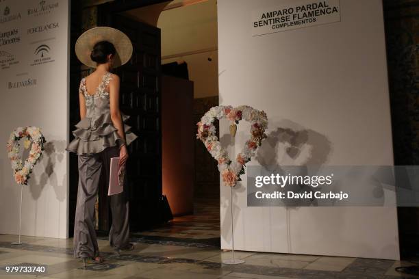 Model walks the runway wearing designs by Aurora Gavino of SQI Handcratf & Fashion 2018 on June 20, 2018 in Seville, Spain.