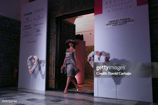 Model walks the runway wearing designs by Aurora Gavino of SQI Handcratf & Fashion 2018 on June 20, 2018 in Seville, Spain.