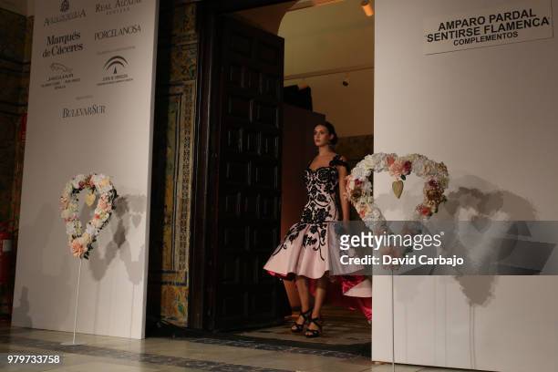Model walks the runway wearing designs by Aurora Gavino of SQI Handcratf & Fashion 2018 on June 20, 2018 in Seville, Spain.