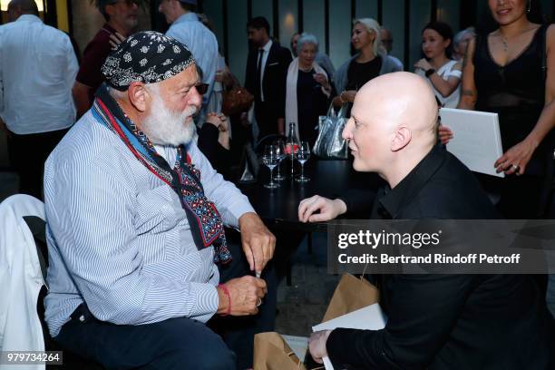 Photographers Bruce Weber and Ali Mahdavi attend photographer Bruce Weber signs the book "Azzedine, Bruce and Joe" at Galerie Azzedine Alaia on June...