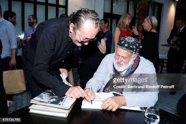 Paolo Roversi and Bruce Weber attend photographer Bruce Weber signs the book "Azzedine, Bruce and Joe" at Galerie Azzedine Alaia on June 20, 2018 in...