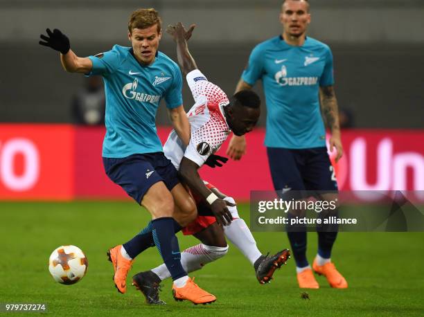 Dpatop - Leipzig's Naby Keita and St. Petersburg's Aleksandr Kokorin battle for the ball during the UEFA Europa League round of 16 first leg soccer...