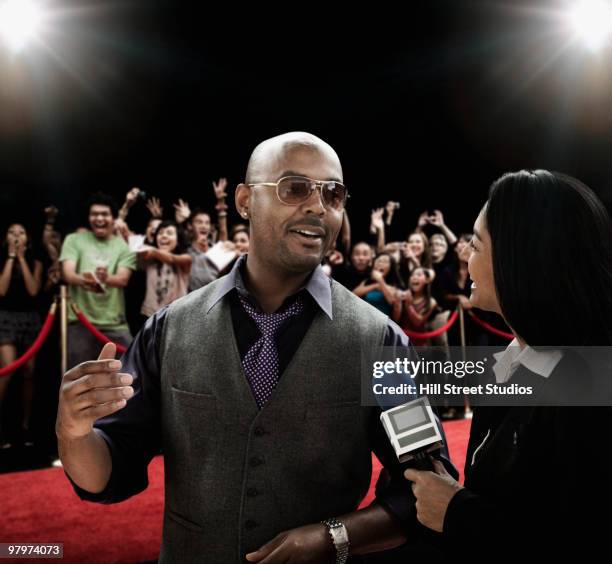 broadcaster interviewing celebrity - fame press stock pictures, royalty-free photos & images