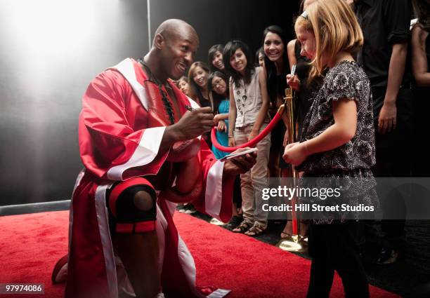 boxer signing autograph for fan - celebrity children stock pictures, royalty-free photos & images