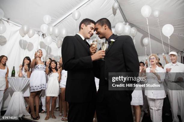 gay married couple enjoying wedding reception - wedding reception stock-fotos und bilder