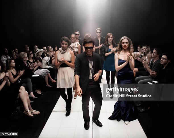 models on runway in fashion show - fashion show crowd stock pictures, royalty-free photos & images