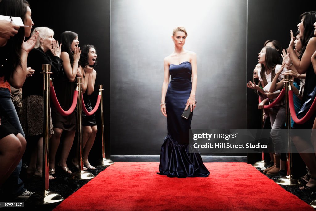 Elegant Caucasian woman posing on red carpet