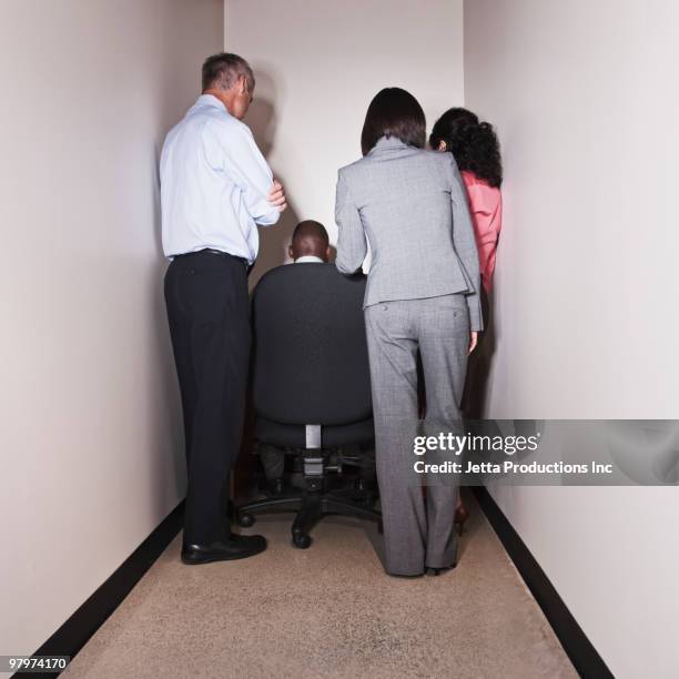 business people having meeting in small office - bustling office stockfoto's en -beelden